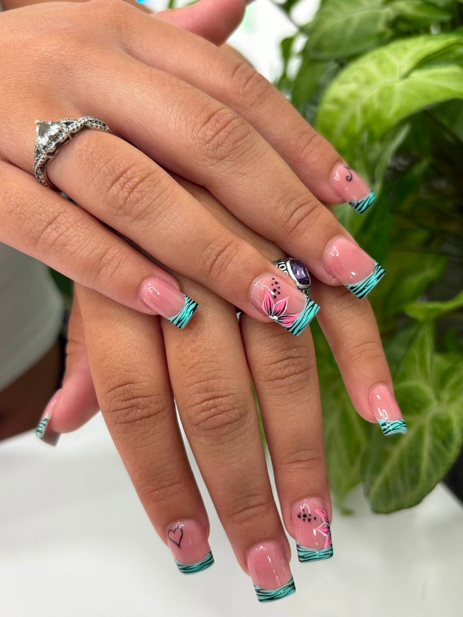 Teal zebra French tips with pink floral accents