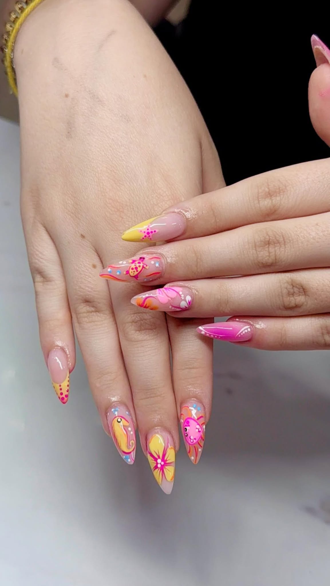Bright tropical pink and yellow nail art