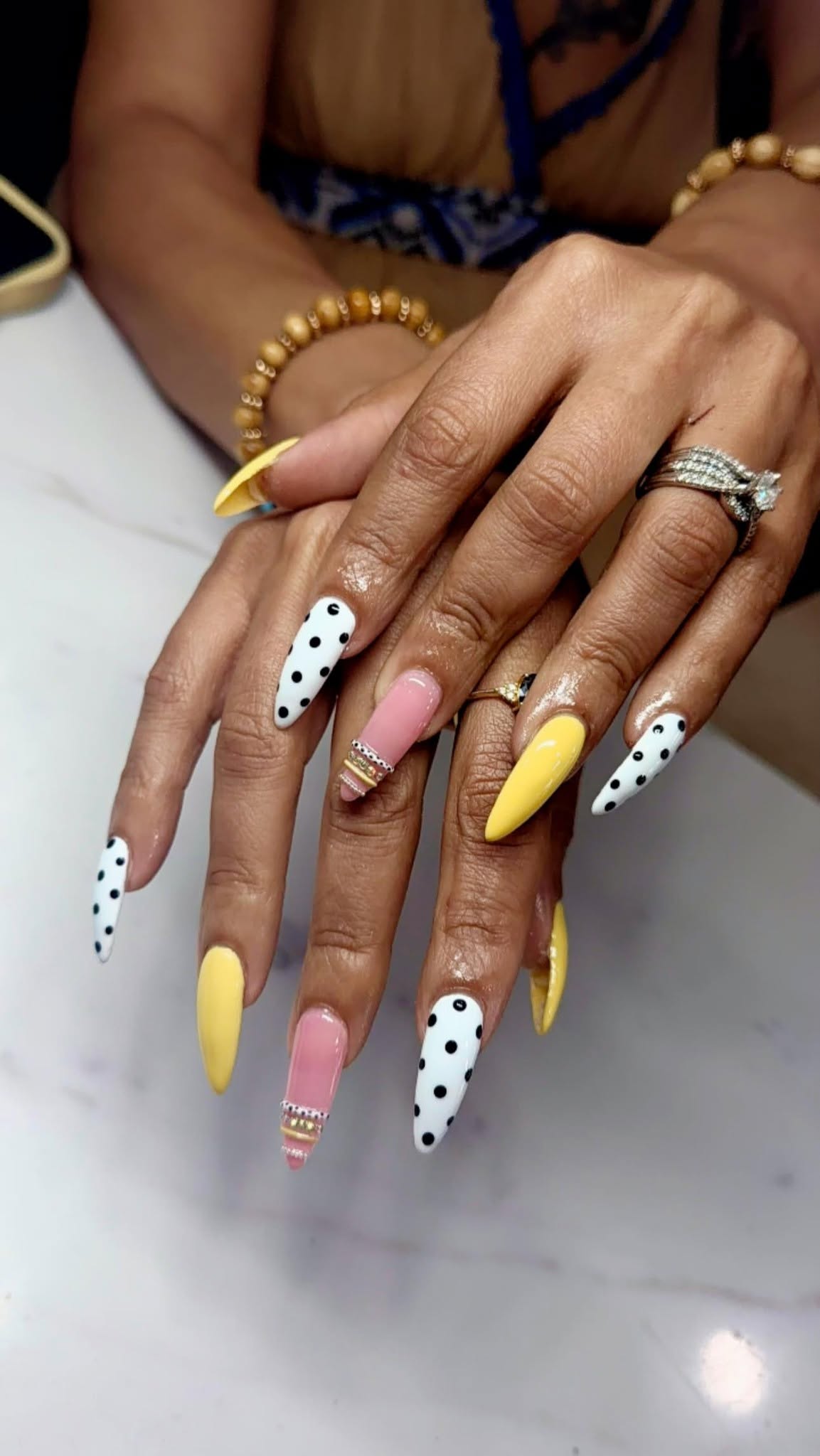 Yellow, pink and polka-dot statement nails